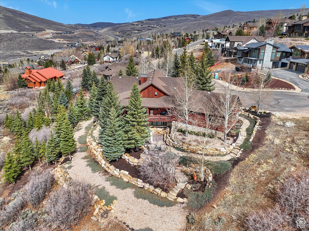 Aerial view of residential area featuring a mountain backdrop