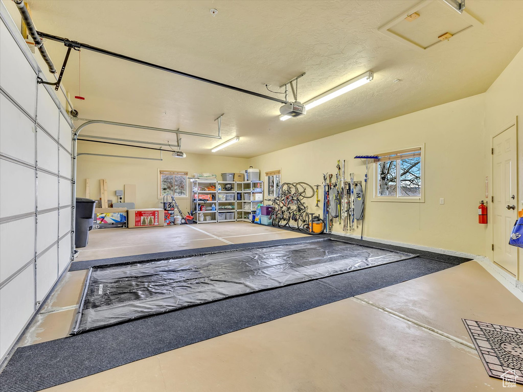 Garage featuring a garage door opener