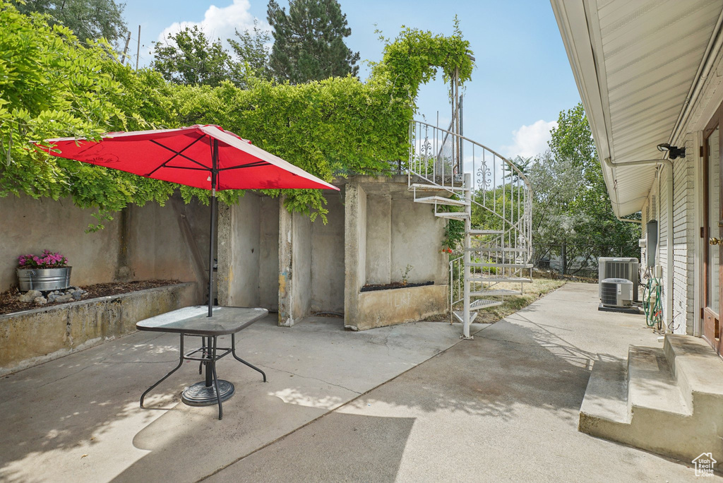 View of patio featuring stairs