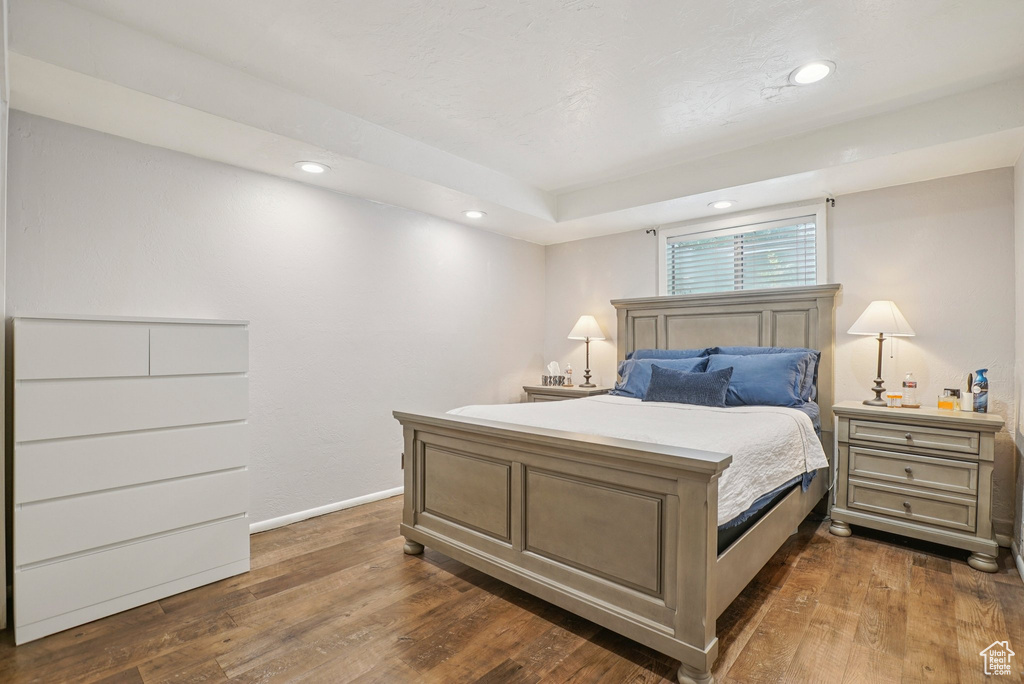 Bedroom featuring dark wood-style flooring and recessed lighting