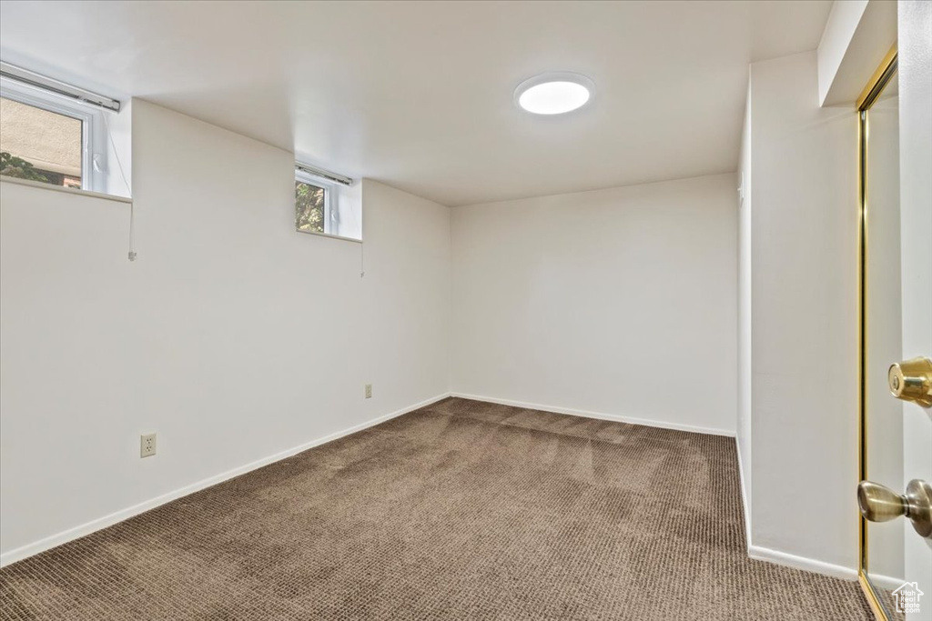 Below grade area with carpet and baseboards