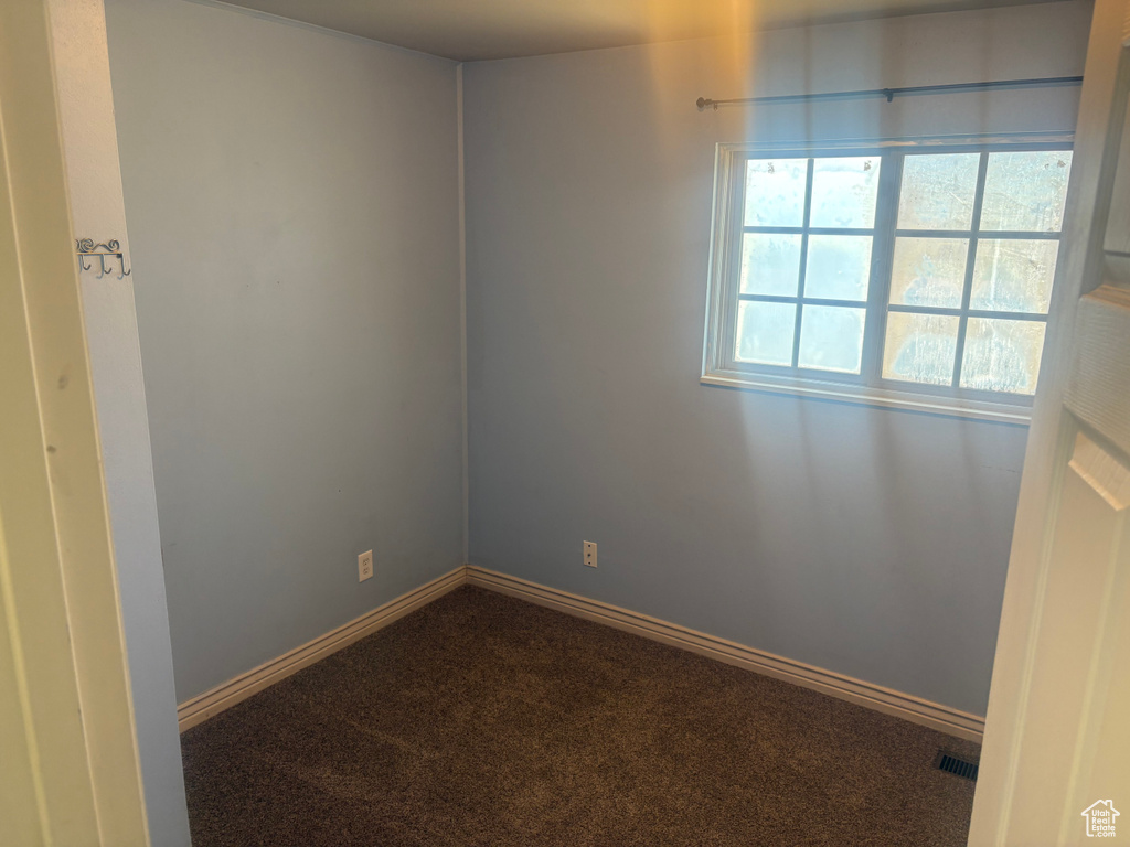 Spare room with carpet floors and baseboards