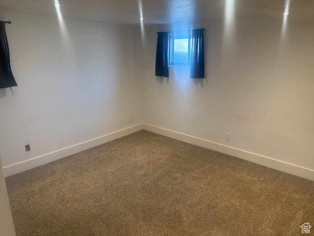 Empty room with dark carpet
