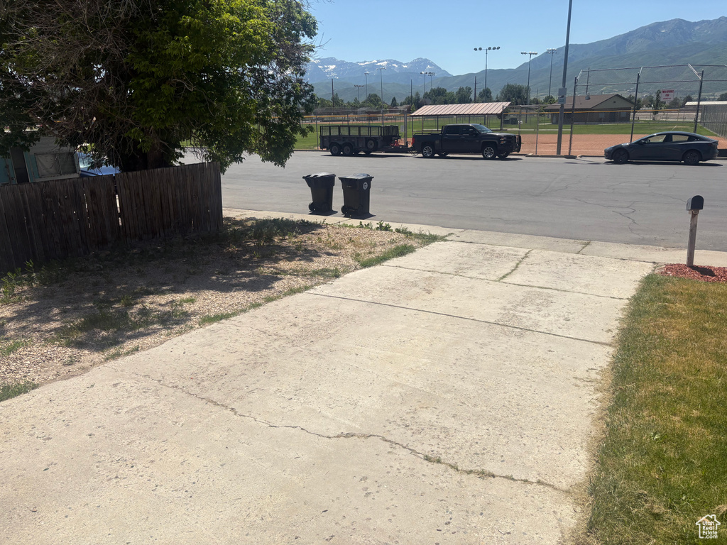 View of concrete driveway featuring a mountain view