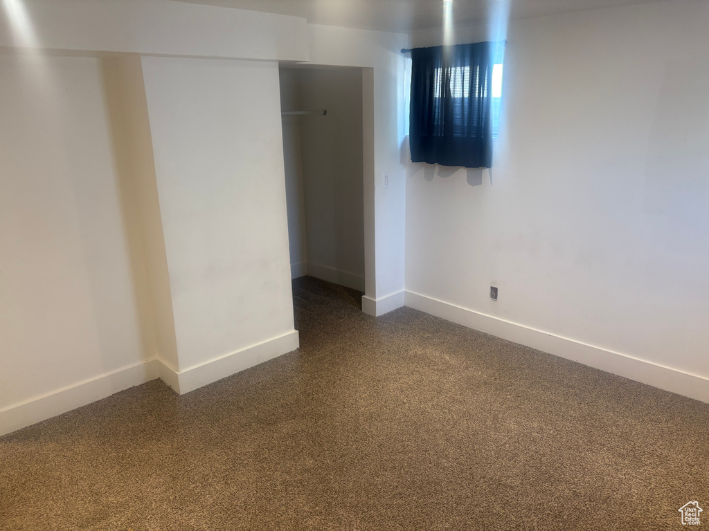 Unfurnished bedroom with baseboards