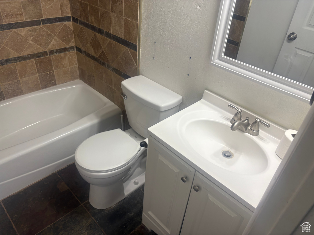 Full bath with toilet and vanity