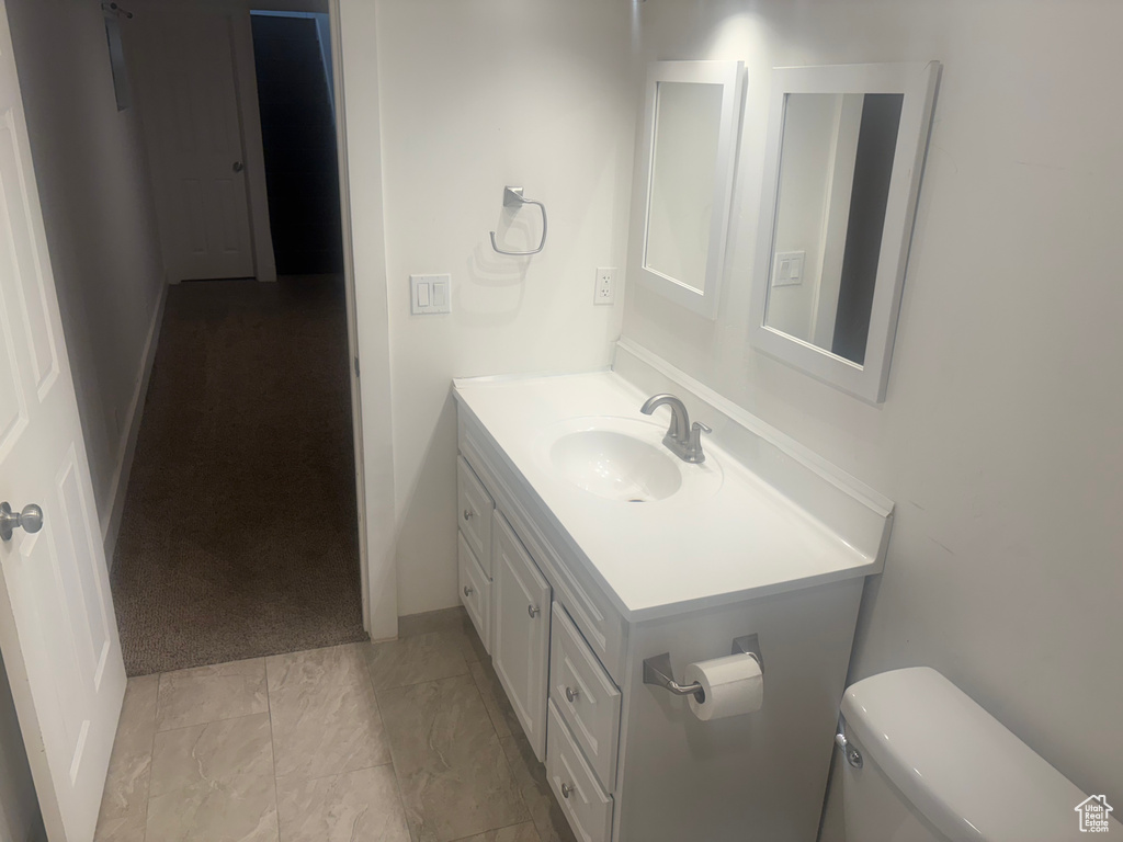 Bathroom with vanity and toilet