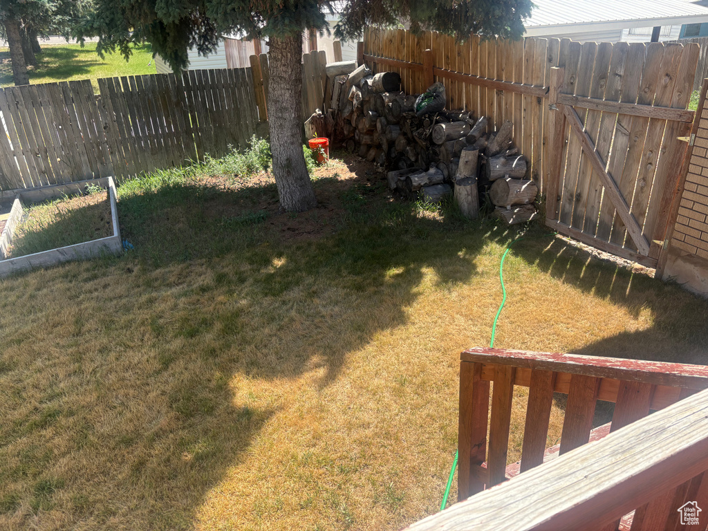 View of fenced backyard