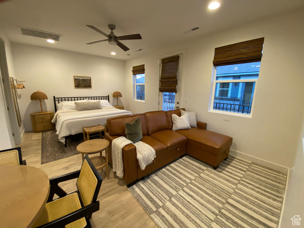 Bedroom featuring light wood-style floors, recessed lighting, and a ceiling fan