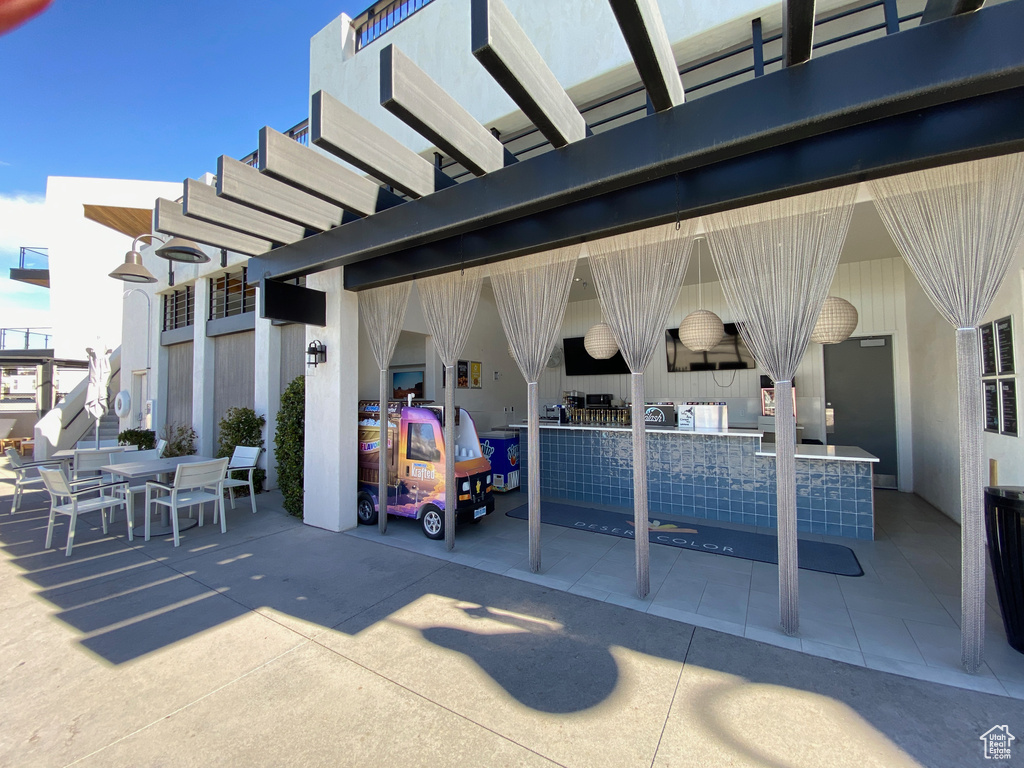 View of patio with outdoor dining area