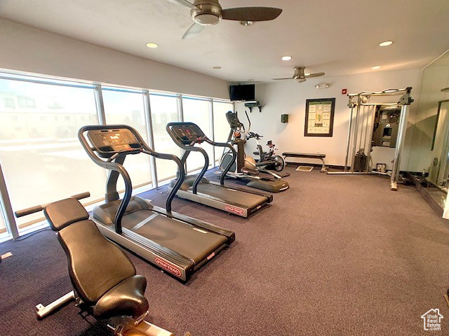 Gym with ceiling fan and recessed lighting