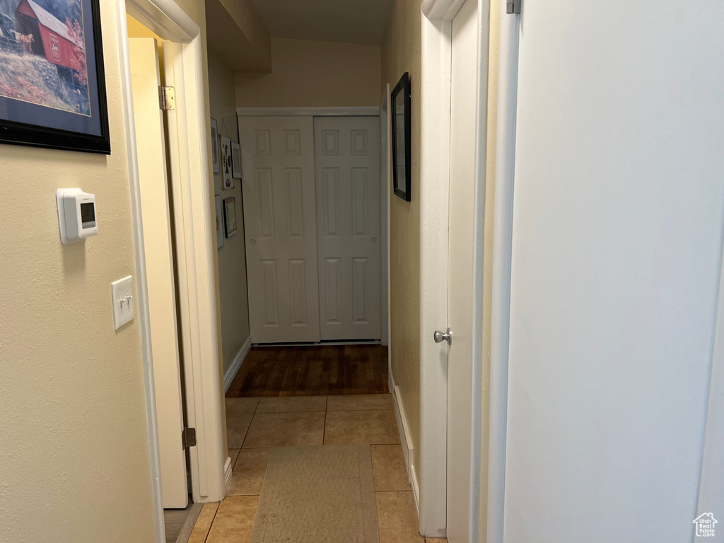 Corridor with light tile patterned floors