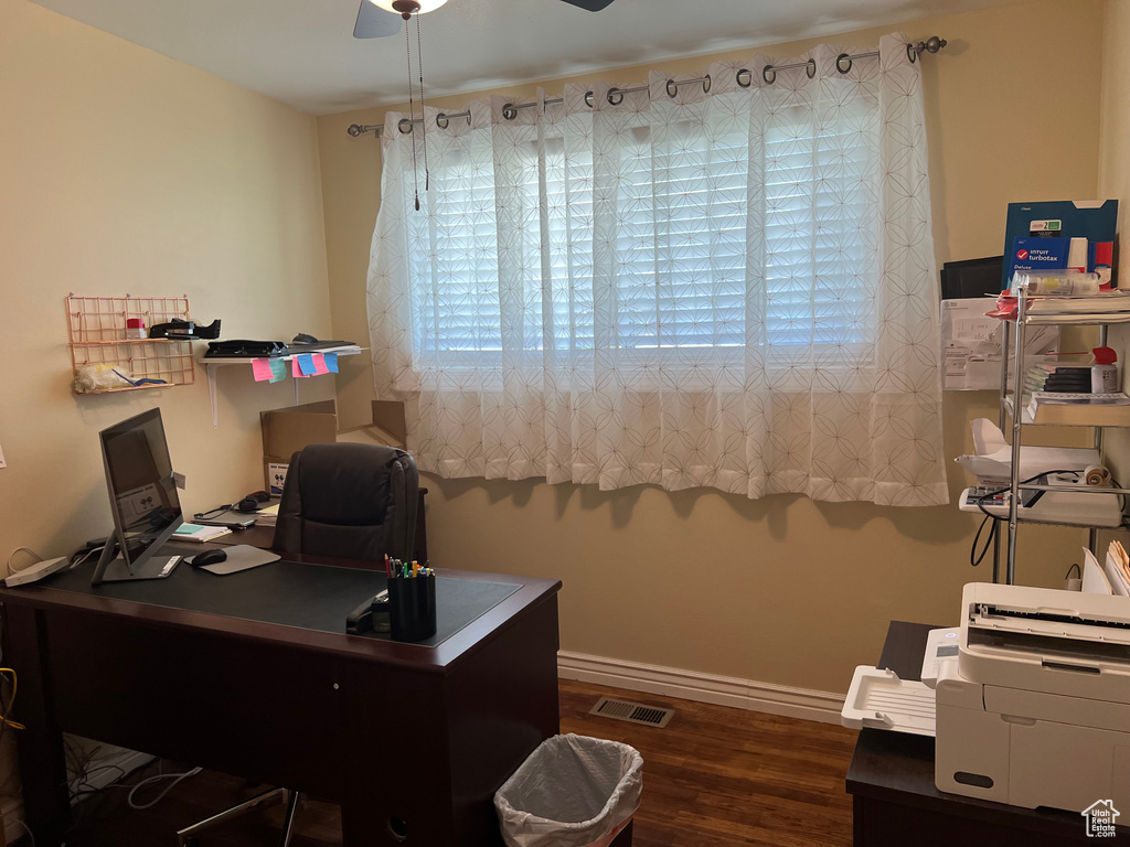 Office space featuring a ceiling fan and wood finished floors