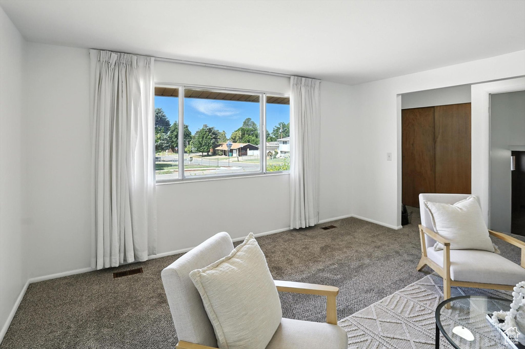 Carpeted office space with baseboards
