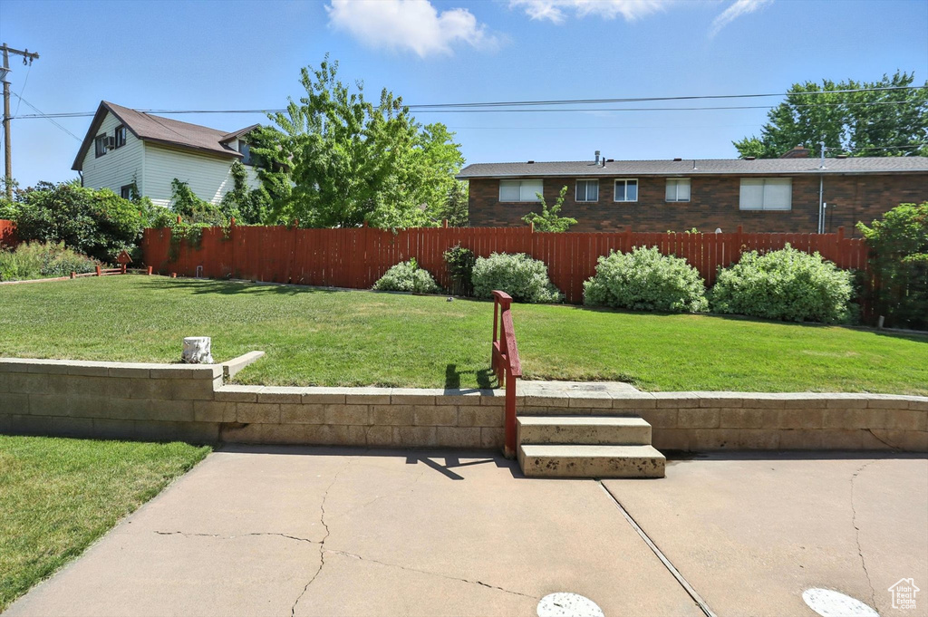 View of yard with a patio