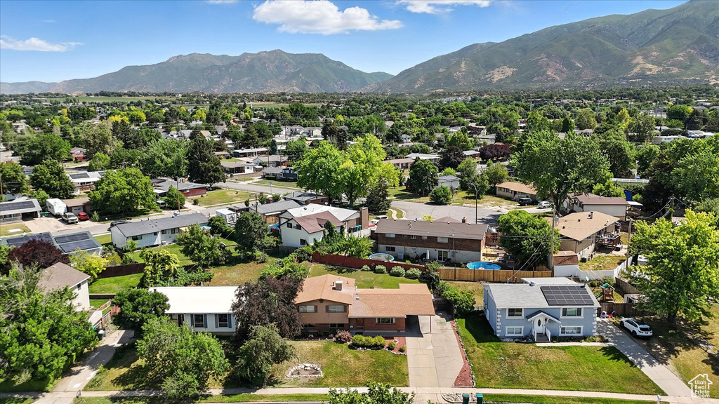 Aerial view of residential area featuring a mountainous background