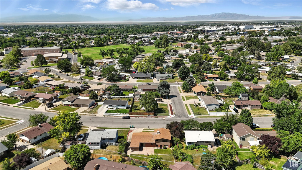 Aerial perspective of suburban area with a mountain backdrop