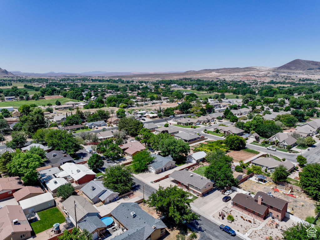 Aerial view of residential area with a mountainous background