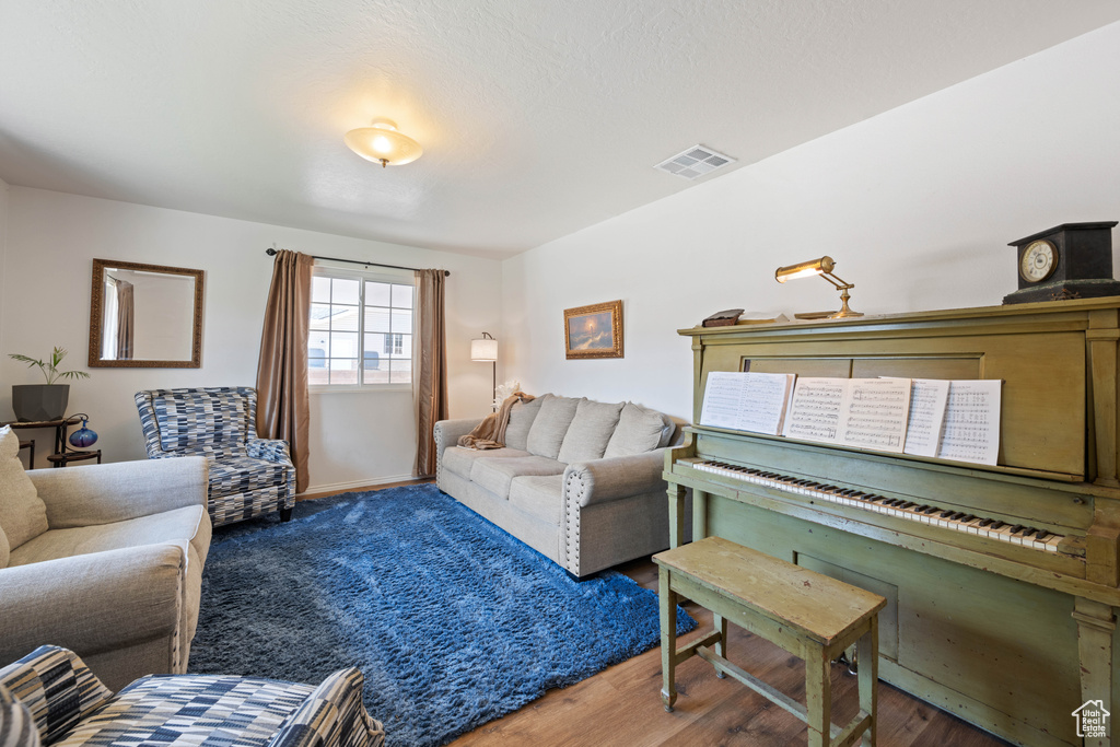 Living room featuring wood finished floors and baseboards