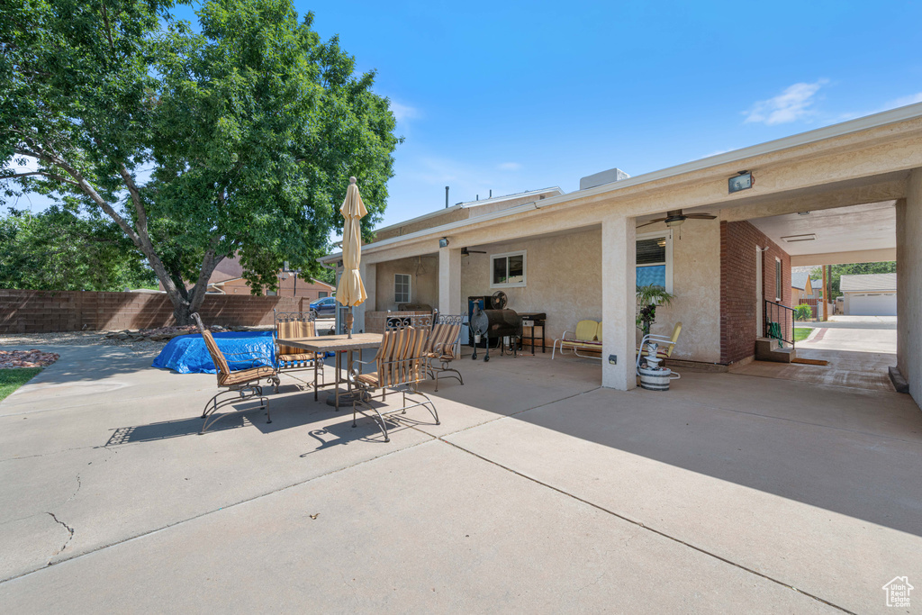 View of patio featuring ceiling fan and outdoor dining area