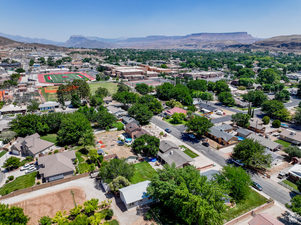Aerial perspective of suburban area with a mountain backdrop