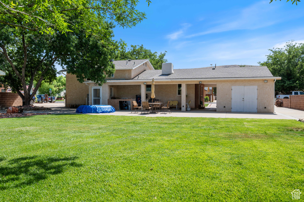 Back of house featuring a patio area and stucco siding