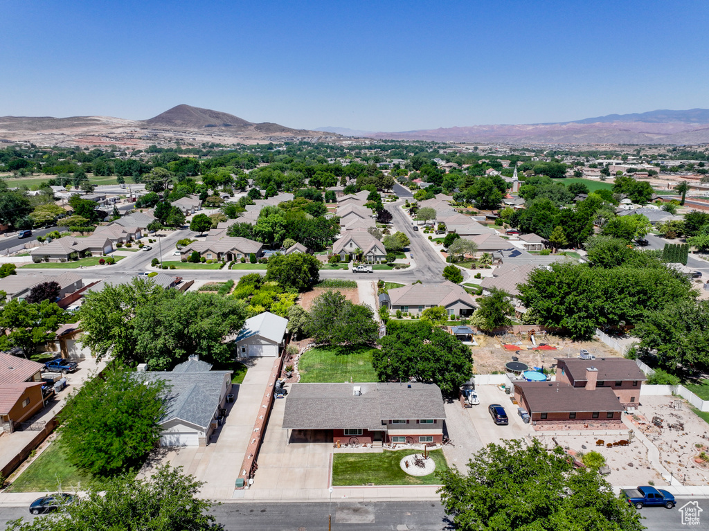 Aerial view of residential area featuring a mountainous background