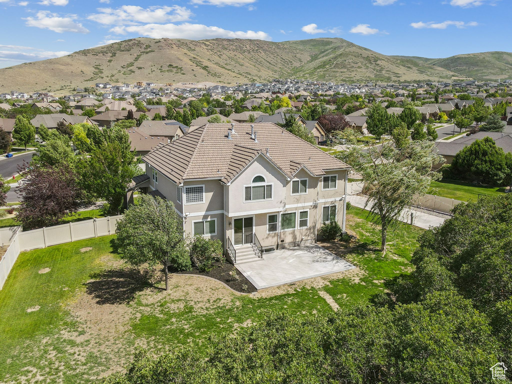 Aerial perspective of suburban area featuring a mountainous background