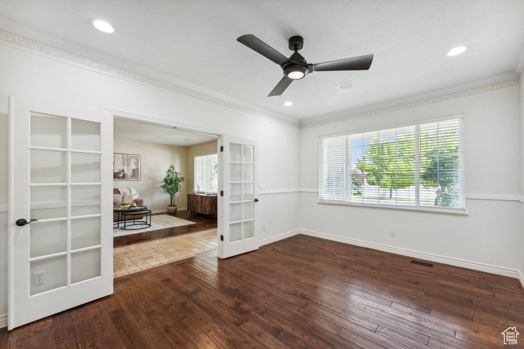 Unfurnished room featuring french doors, ornamental molding, hardwood / wood-style floors, ceiling fan, and recessed lighting