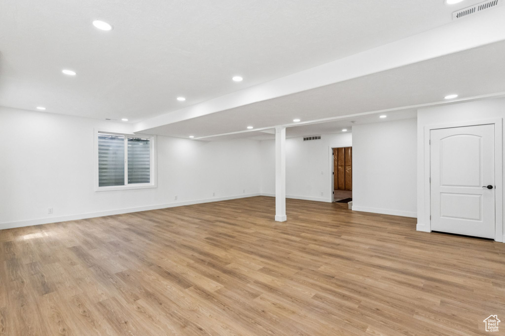 Finished basement featuring recessed lighting and light wood-type flooring