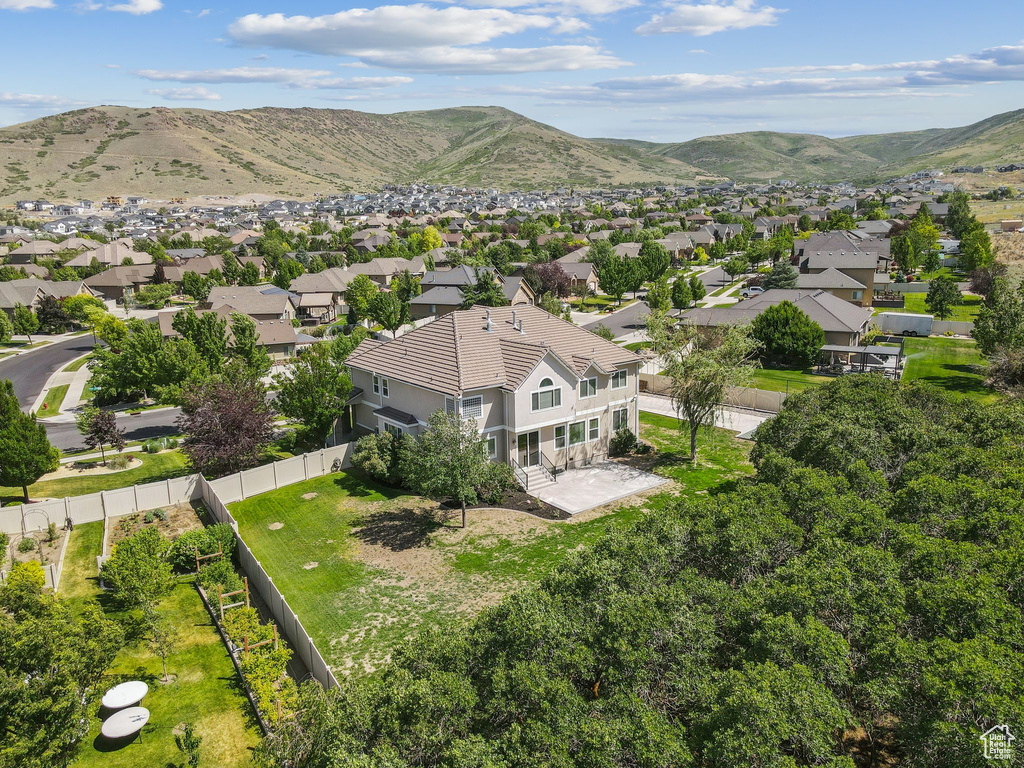 Aerial perspective of suburban area with a mountainous background