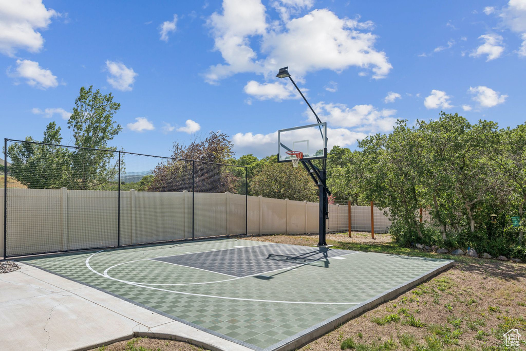 View of basketball court featuring basketball hoop