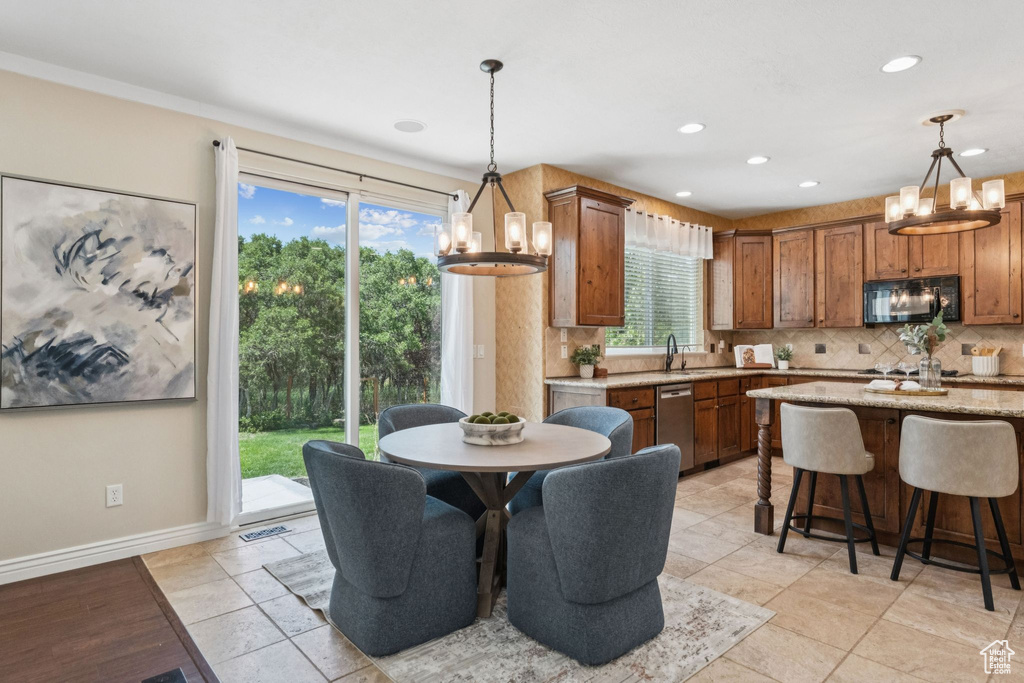 Dining area featuring a chandelier and recessed lighting