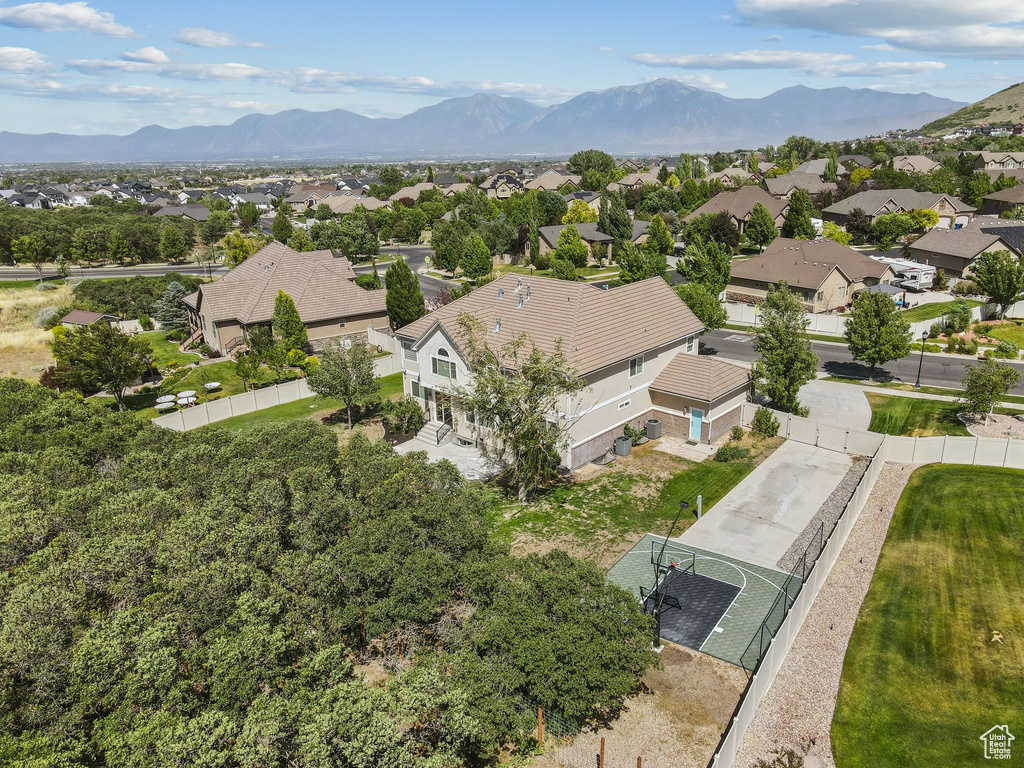 Aerial view of residential area featuring mountains