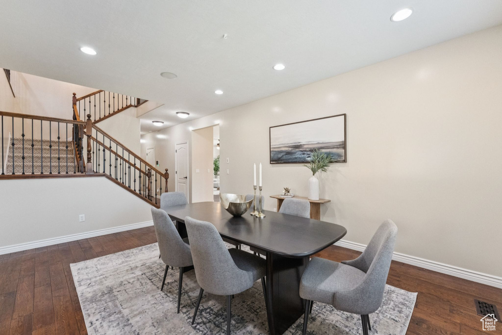 Dining room with stairway, hardwood / wood-style flooring, and recessed lighting