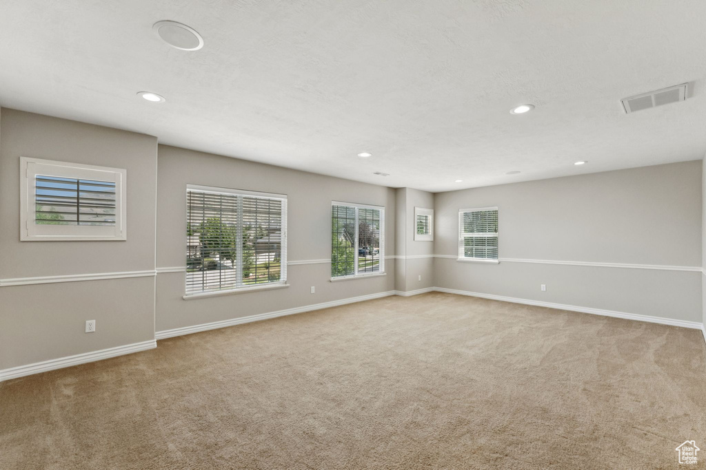 Unfurnished room featuring carpet floors and recessed lighting