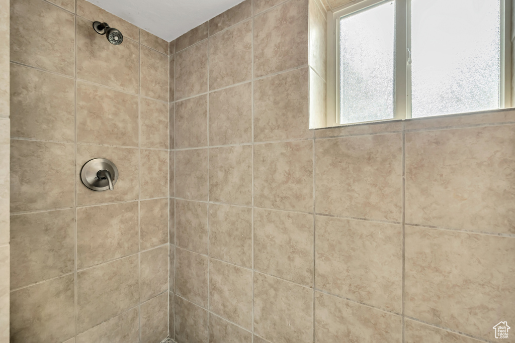 Full bath with tiled shower