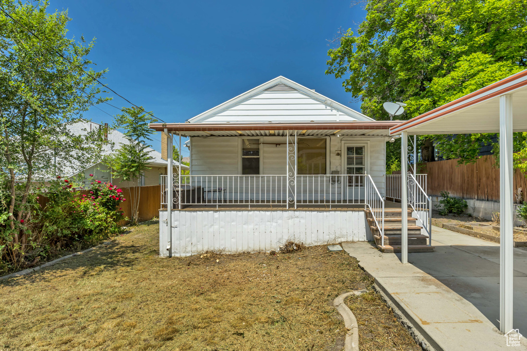 Bungalow featuring a porch