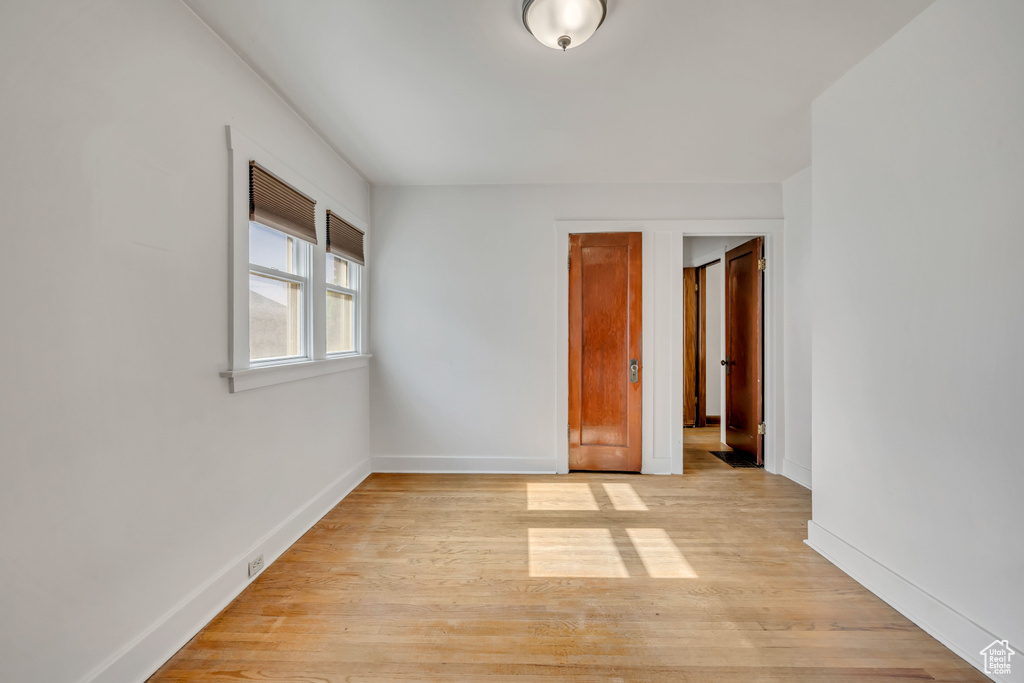 Unfurnished bedroom with light wood-style floors