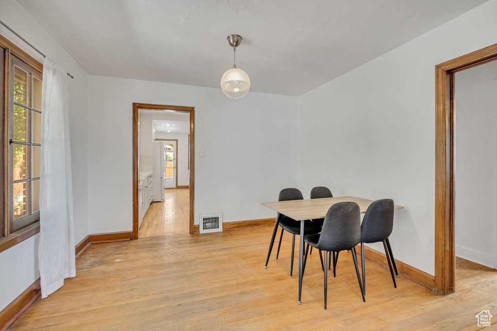 Dining area featuring baseboards and light wood finished floors
