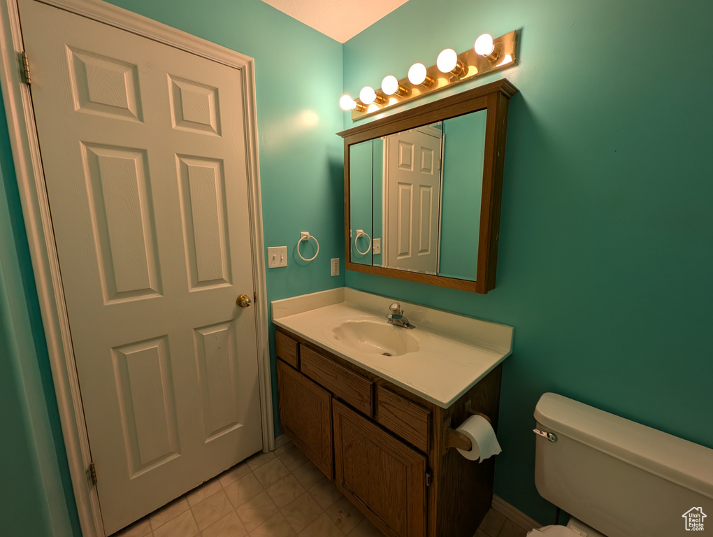 Bathroom with vanity and tile patterned floors