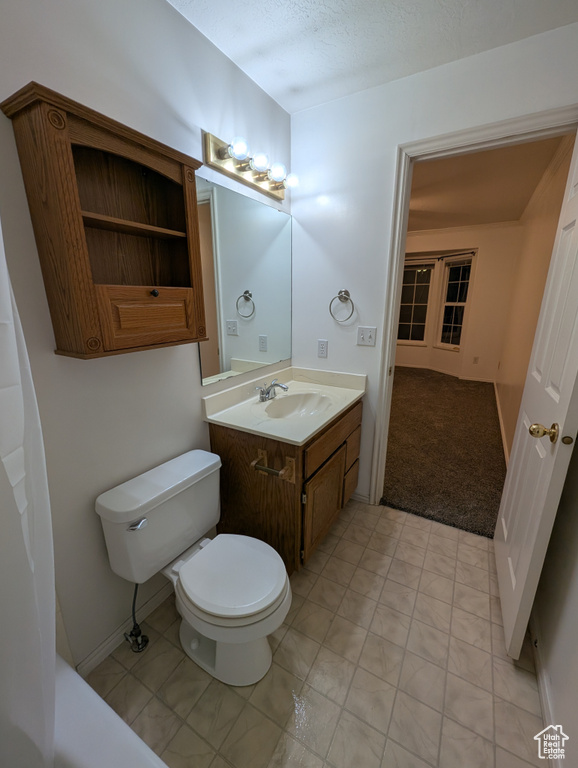 Bathroom featuring toilet and vanity