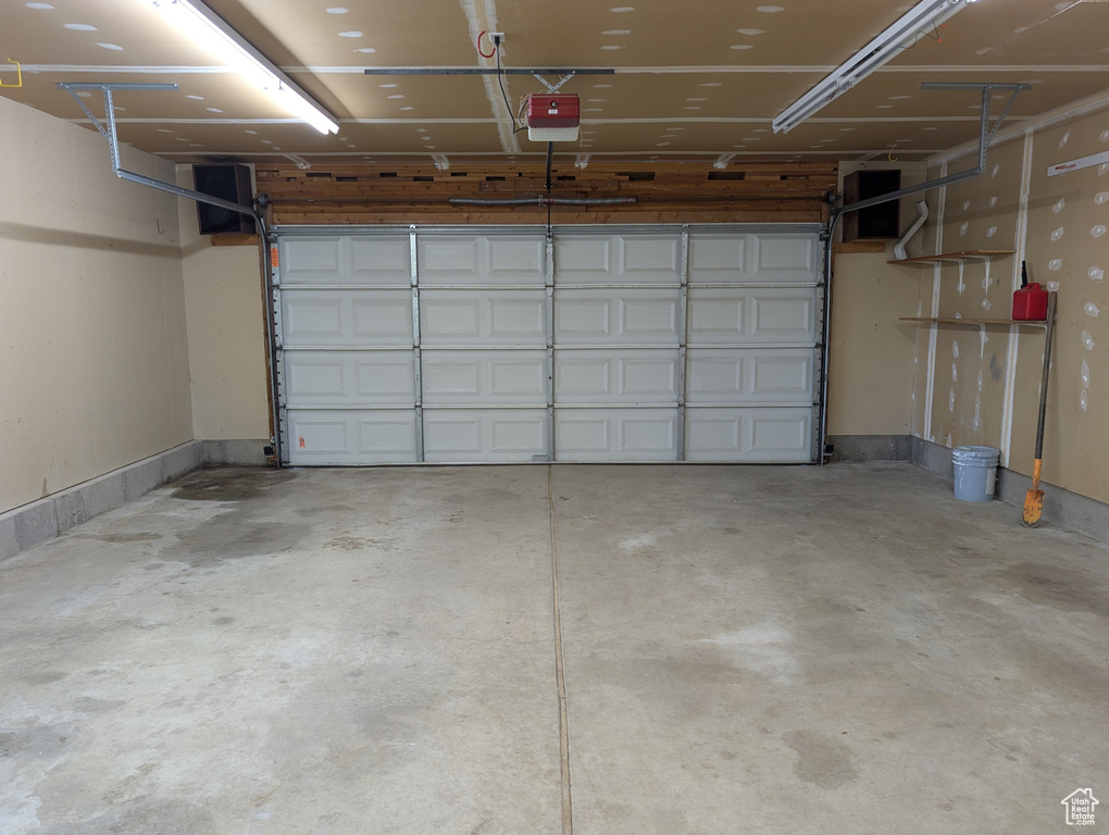 Garage featuring a garage door opener