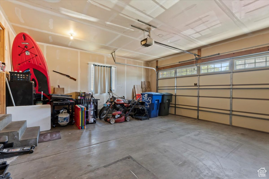 Garage featuring a garage door opener