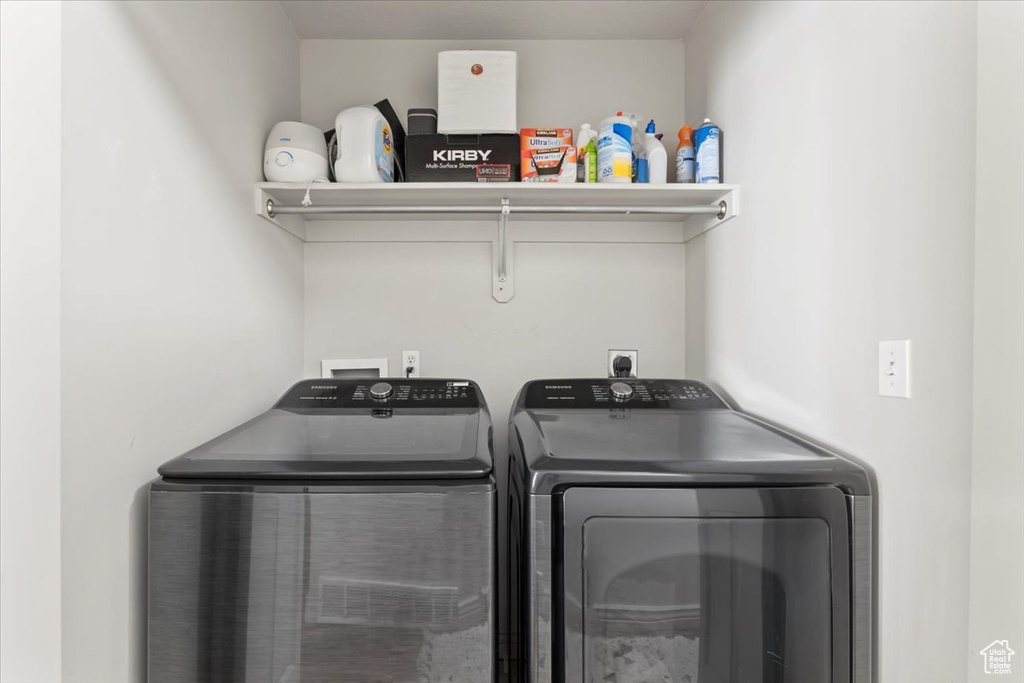 Laundry area with washer and clothes dryer