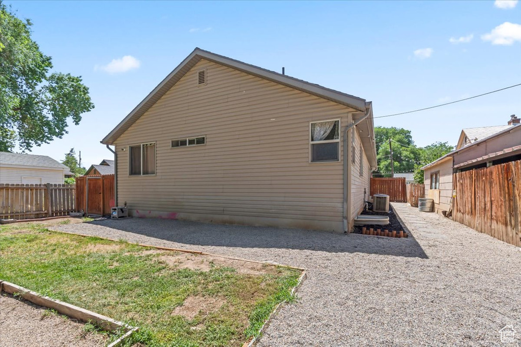 Back of property with a fenced backyard and a patio area