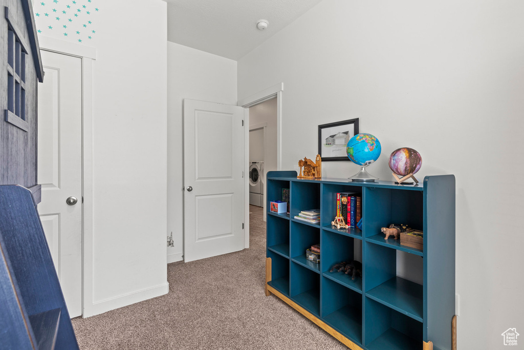 Rec room featuring carpet floors and washer / clothes dryer