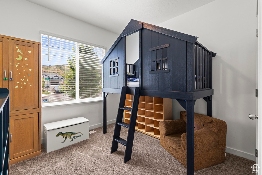 Bedroom featuring carpet floors
