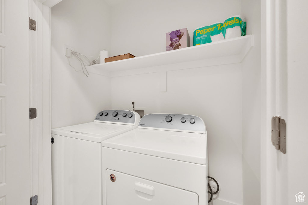 Washroom featuring washing machine and clothes dryer