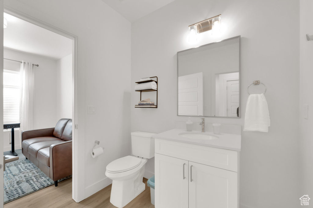 Bathroom with wood finished floors and vanity